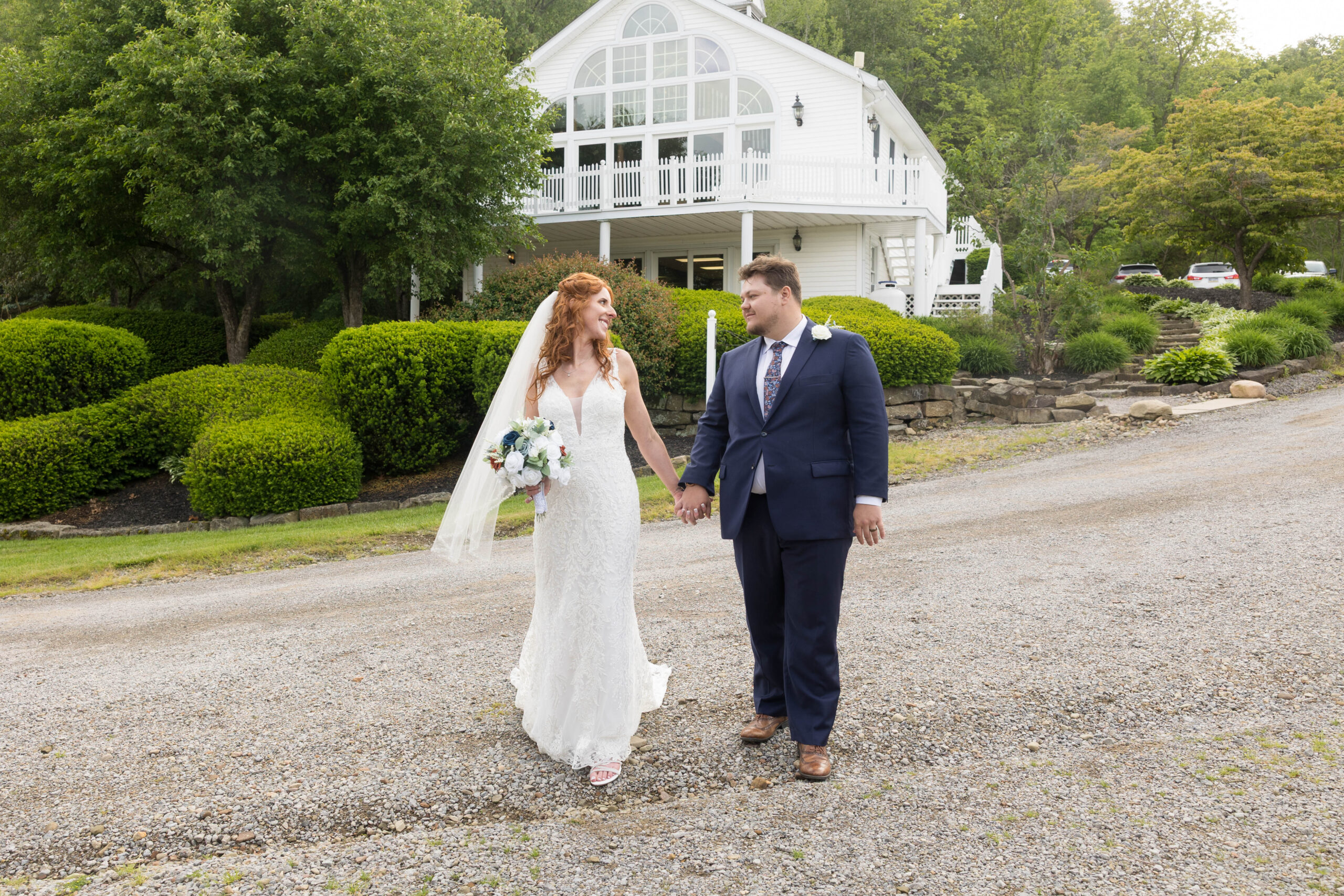 Sparrow Hill Venue couple walking in front of The Cherry Hall on their wedding day.